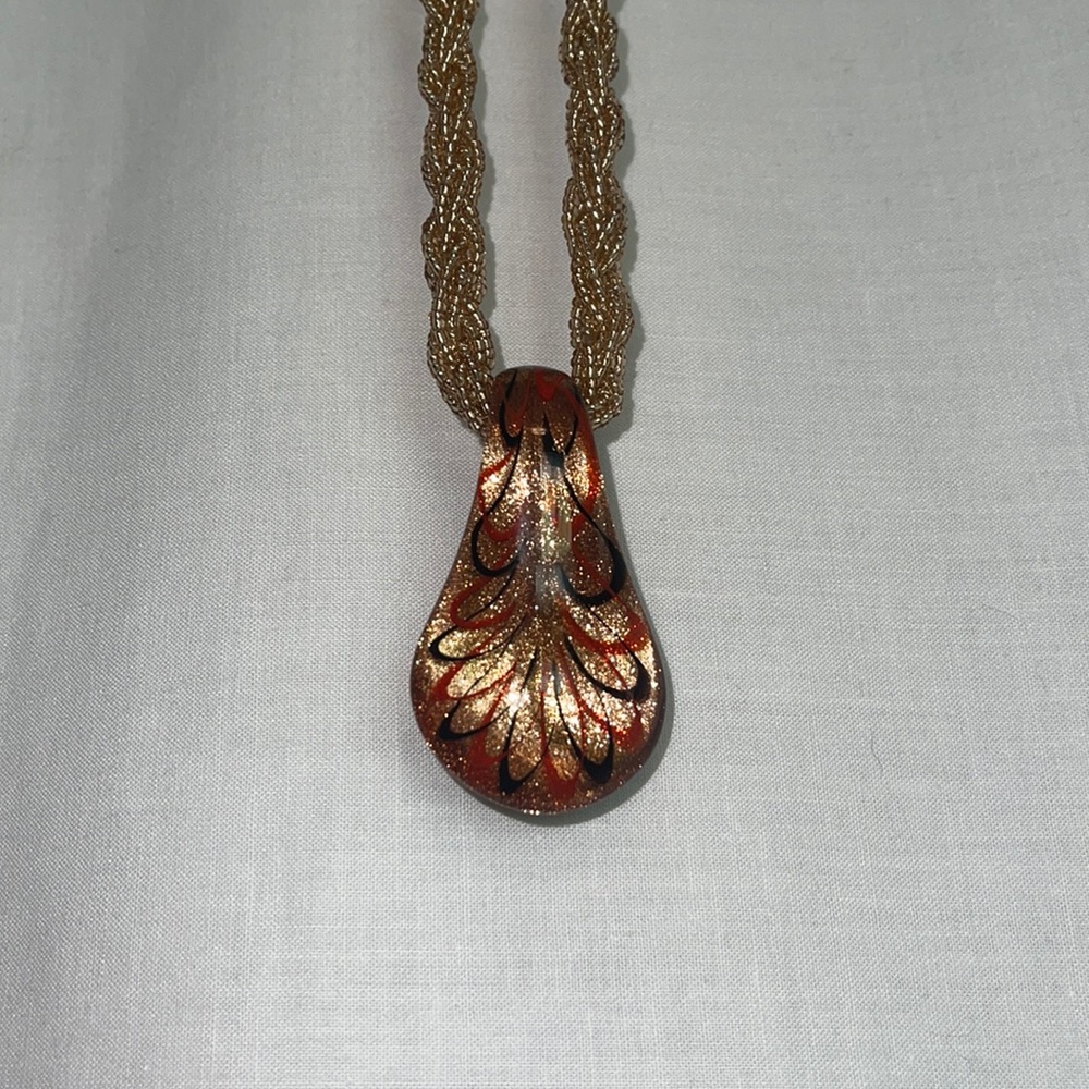 Art glass necklace on beaded braid strand. Lobster claw clasp